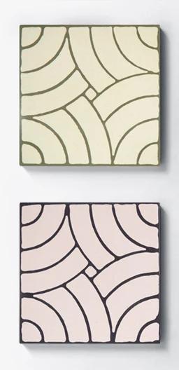 Two colourful cement tiles in the same pattern and different colours
